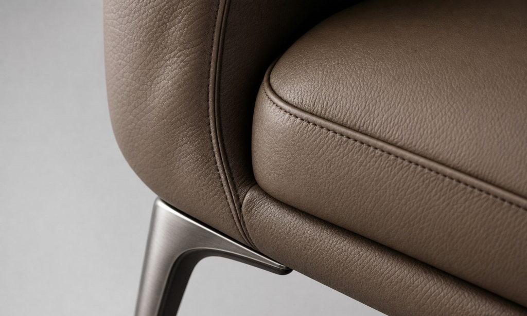 Close-up photorealistic furniture rendering showing realistic leather and metal texture